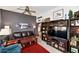 Living room with dark leather sofa and built-in shelving at 16832 N Pine Valley Dr, Sun City, AZ 85351