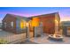 Charming home exterior with a fire pit and gated entrance at 19711 W Georgia Ave, Litchfield Park, AZ 85340