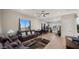 Open living area with kitchen, comfortable couches, and large windows at 19711 W Georgia Ave, Litchfield Park, AZ 85340
