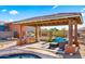 Relaxing patio with a built-in grill and seating area at 19711 W Georgia Ave, Litchfield Park, AZ 85340