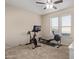 Home gym with exercise bike and rowing machine at 21806 N Aztec Ct, Sun City West, AZ 85375