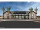 Modern community center with solar panels and palm trees at 22693 E Happy Rd, Queen Creek, AZ 85142