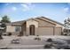 Single-story home with three-car garage and desert landscaping at 22693 E Happy Rd, Queen Creek, AZ 85142