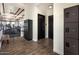Hallway with lockers leading to a fitness center at 22693 E Happy Rd, Queen Creek, AZ 85142
