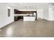 Open concept kitchen with island and dark cabinetry at 22794 E Via Las Brisas --, Queen Creek, AZ 85142