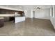 Modern kitchen with a large island and dark cabinets at 22794 E Via Las Brisas --, Queen Creek, AZ 85142