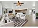 Open living area with modern furniture and a kitchen island at 22794 E Via Las Brisas --, Queen Creek, AZ 85142