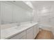 Well-lit bathroom features dual sinks and a tub-shower combination at 23048 E Watford Dr, Queen Creek, AZ 85142