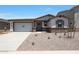 Charming single-story home featuring a neutral color palette, a two-car garage and low-maintenance landscaping at 23048 E Watford Dr, Queen Creek, AZ 85142