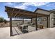 Covered outdoor kitchen area with grills and seating for residents at 23048 E Watford Dr, Queen Creek, AZ 85142