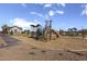 Community playground with modern play structures at 23048 E Watford Dr, Queen Creek, AZ 85142