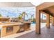 Relaxing backyard with a pool and an outdoor kitchen at 2315 S 173Rd Dr, Goodyear, AZ 85338