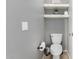 Small bathroom with toilet and floating shelves at 2315 S 173Rd Dr, Goodyear, AZ 85338