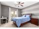 Bedroom with a double bed, desk, and window at 2315 S 173Rd Dr, Goodyear, AZ 85338