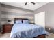 Bedroom with double bed, nightstands, and ceiling fan at 2315 S 173Rd Dr, Goodyear, AZ 85338