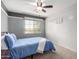 Bedroom with queen bed and ceiling fan at 2315 S 173Rd Dr, Goodyear, AZ 85338
