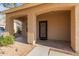 Covered front porch with decorative wrought-iron front door at 2315 S 173Rd Dr, Goodyear, AZ 85338