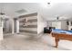 Open game room with pool table and sitting area at 2315 S 173Rd Dr, Goodyear, AZ 85338