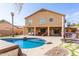 Two-story house with a large backyard, pool, and outdoor kitchen at 2315 S 173Rd Dr, Goodyear, AZ 85338