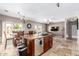 Open concept kitchen with island and stainless steel appliances at 2315 S 173Rd Dr, Goodyear, AZ 85338