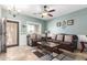 Living room with a brown leather sofa, coffee table, and decorative accents at 2315 S 173Rd Dr, Goodyear, AZ 85338