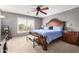 Main bedroom with a king-size bed and ceiling fan at 2315 S 173Rd Dr, Goodyear, AZ 85338
