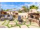 Relaxing patio with lounge chairs and an outdoor fireplace at 2315 S 173Rd Dr, Goodyear, AZ 85338