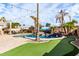 Entertaining backyard with a refreshing pool and a mini putting green at 2315 S 173Rd Dr, Goodyear, AZ 85338