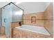 Bathroom with soaking tub and glass shower at 23236 N 32Nd Dr, Phoenix, AZ 85027