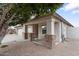 Side view of the house with a stone accent porch at 23236 N 32Nd Dr, Phoenix, AZ 85027