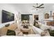 Open and spacious living room with a large TV and comfortable seating at 24241 W Agora Ln, Buckeye, AZ 85326