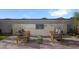 Outdoor kitchen area with built-in grill and seating for relaxing at 24241 W Agora Ln, Buckeye, AZ 85326