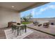 Covered patio features outdoor seating and a spacious backyard at 24241 W Agora Ln, Buckeye, AZ 85326