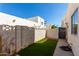 Private backyard with artificial turf and block wall at 2548 W Monte Cristo Ave, Phoenix, AZ 85023