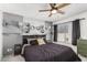 Cozy bedroom with a comfortable bed and decorative wall accents at 2548 W Monte Cristo Ave, Phoenix, AZ 85023
