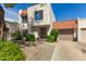 Charming two-story stucco home with tile roof and landscaped front yard at 2548 W Monte Cristo Ave, Phoenix, AZ 85023