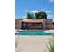 Community pool with shade structure and lounge chairs at 2548 W Monte Cristo Ave, Phoenix, AZ 85023