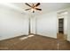 Spacious bedroom with ceiling fan and carpet at 31957 N 125Th Ave, Peoria, AZ 85383