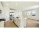 Modern kitchen with white cabinets, island, and stainless steel appliances at 31957 N 125Th Ave, Peoria, AZ 85383