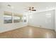 Bright living room with tile floors and ceiling fan at 31957 N 125Th Ave, Peoria, AZ 85383