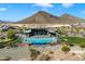 Community pool with lounge chairs and mountain backdrop at 31957 N 125Th Ave, Peoria, AZ 85383