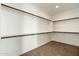 Large walk-in closet with ample shelving and hanging space at 31957 N 125Th Ave, Peoria, AZ 85383