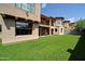 Artificial turf backyard with patio and a view of the house at 3804 E Camelback Rd, Phoenix, AZ 85018