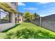 Artificial turf backyard with a large wall and a view of the house at 3804 E Camelback Rd, Phoenix, AZ 85018