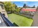 Artificial turf backyard with a wall and gate at 3804 E Camelback Rd, Phoenix, AZ 85018