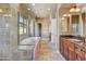 Elegant bathroom with double vanity, soaking tub, and tile floors at 3804 E Camelback Rd, Phoenix, AZ 85018