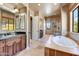 Primary bathroom with soaking tub and dual sinks at 3804 E Camelback Rd, Phoenix, AZ 85018