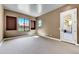 Bright bedroom with carpet flooring and exterior access at 3804 E Camelback Rd, Phoenix, AZ 85018