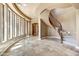 Grand entry with curved staircase and high ceilings at 3804 E Camelback Rd, Phoenix, AZ 85018