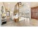 Spacious living area with high ceilings, fireplace, and access to backyard at 3804 E Camelback Rd, Phoenix, AZ 85018